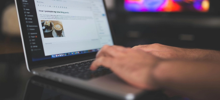 a person typing on a laptop